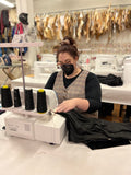 girl serging on sewing machine