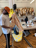 man ironing fabric