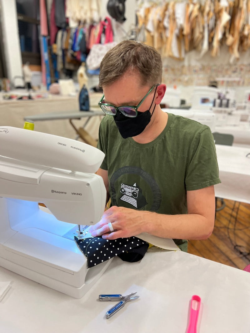 sexy man sewing