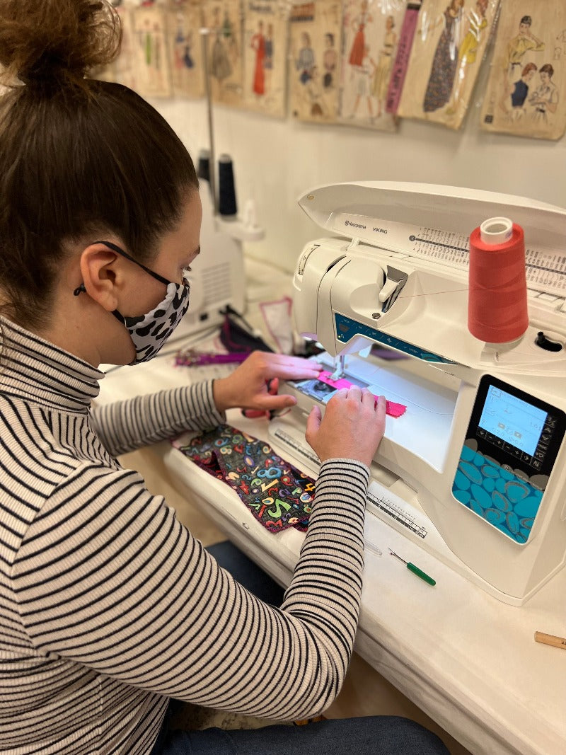 girl sewing on sewing machine