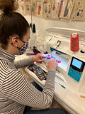 girl sewing on sewing machine