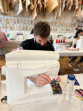 man sewing